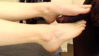 Amateur wife has a black guy covering her sexy feet with cum