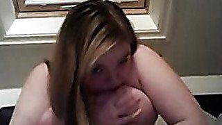 Fat white chick kisses and plays with her big tits. Homemade video.