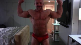 Ali Badi Posing in Red Trunks