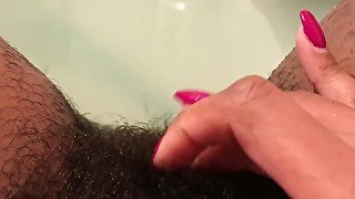 Masturbating my hairy pussy in the tub. JUICY