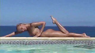 Blonde strips from bikini and takes a dip