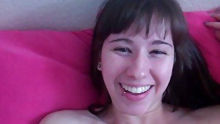 Young brunette masturbates with dildo in her bedroom