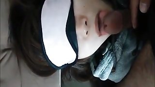 Blindfolded girlfriend sucking a cock
