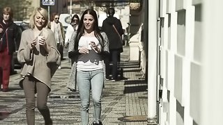 Stunning blonde and brunette go on a stroll to get some cofee.