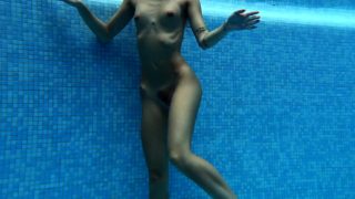 Tiffany Tatum strips naked underwater