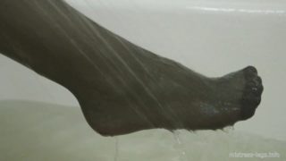 Black stockings in the bathroom and under the shower