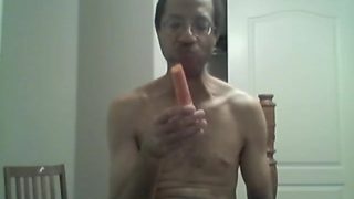 BLACK GAY STICKS CARROT IN ASS AND EATS IT