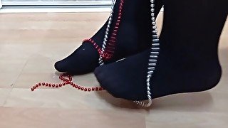 nylon feet playing with silver & red pearls