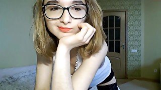 Cute teen Lina in glasses on webcam