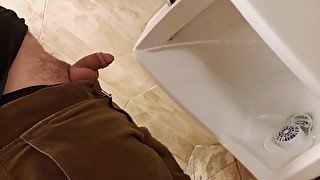 Pissing in urinal