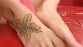 Tattooed girl gives hot footjob