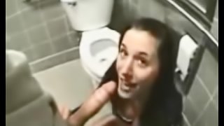 Brunette hussy enjoys ardent upskirt sex in a toilet