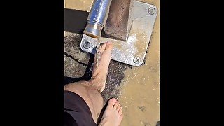 FTM hairy bare feet wandering through public beach & getting cleaned