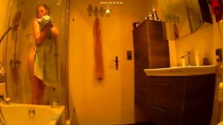 Slim young girl with tiny boobs takes a shower on hidden cam