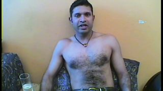 Horny dude with a hairy chest strips off his clothes and sucks a big dick