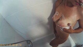 Amateur teen in the shower massages her tits and fingers her soft pussy